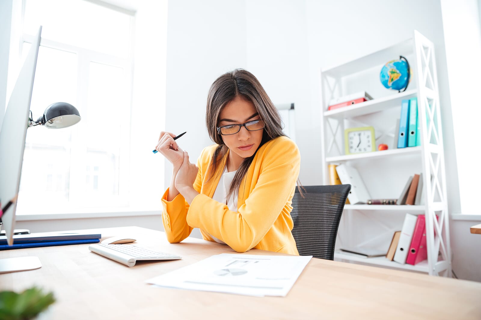 Businesswoman analysing document in office